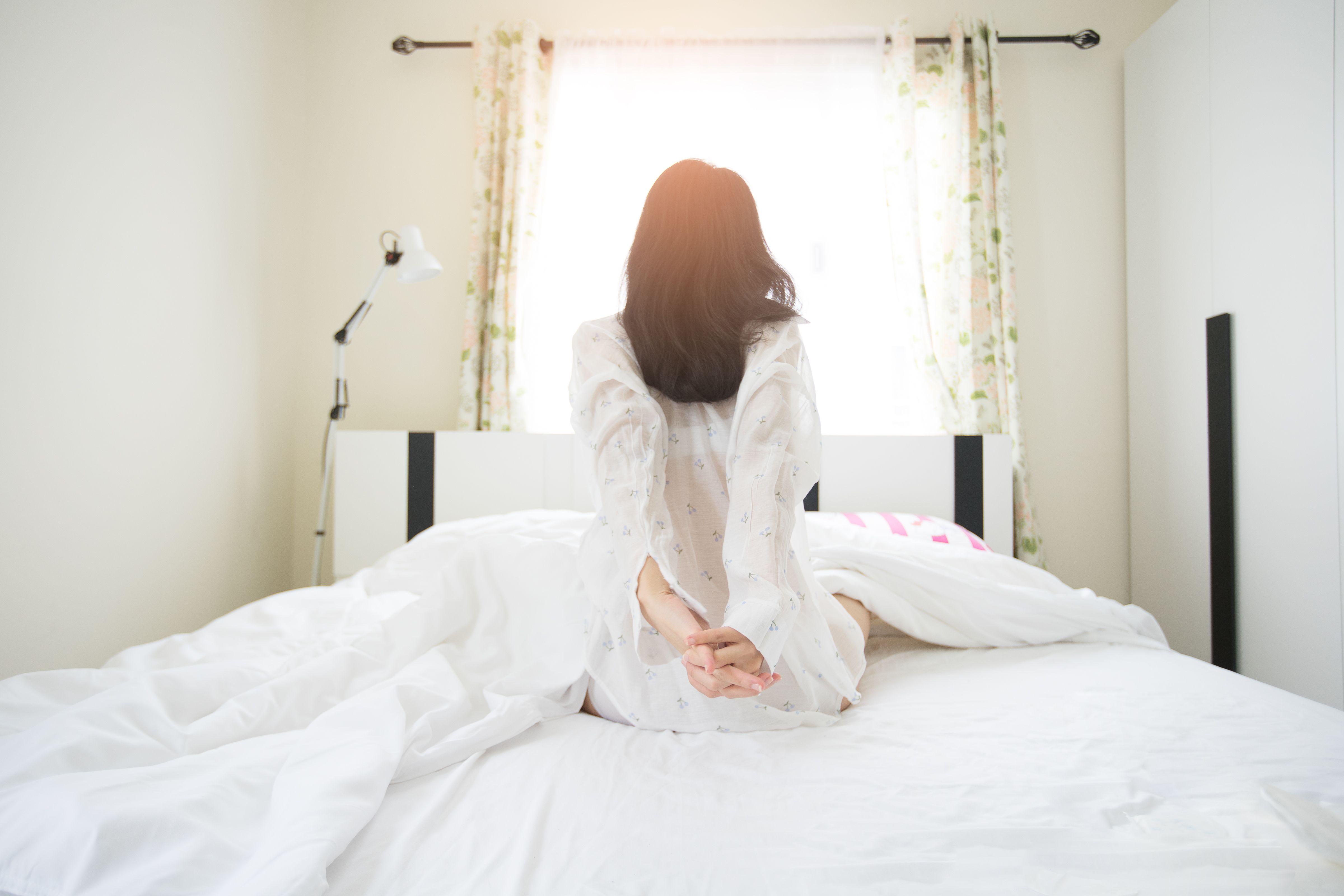 https://hips.hearstapps.com/hmg-prod/images/beautiful-asian-girl-lazy-wake-up-in-early-morning-royalty-free-image-1071974586-1544546679.jpg