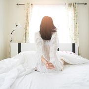 Beautiful Asian Girl lazy wake up in early morning
