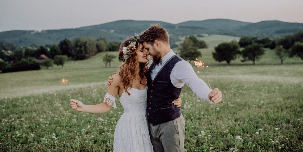 beautiful bride and groom at sunset in green nature