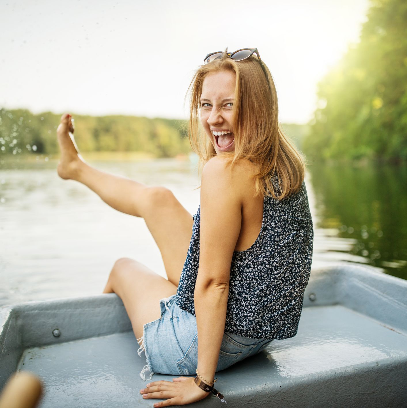 beautiful female on boat ride in lake having fun