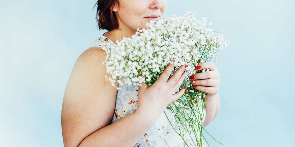 beautiful plump woman with a spring bouquet