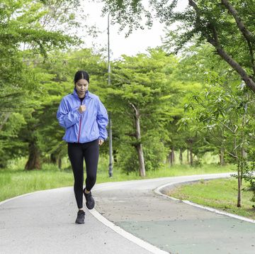 beautiful sport woman in sportswear running in the park. healthy lifestyle and sport concept