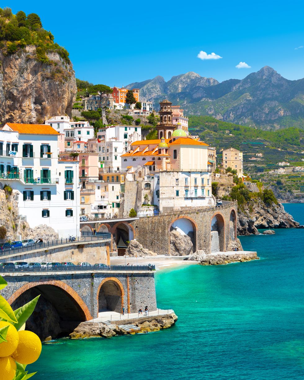 beautiful view of amalfi on the mediterranean coast with lemons in the foreground, italy