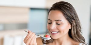 beautiful woman eating a healthy snack