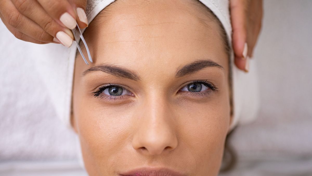 close up on the face of a young woman staring into the camera