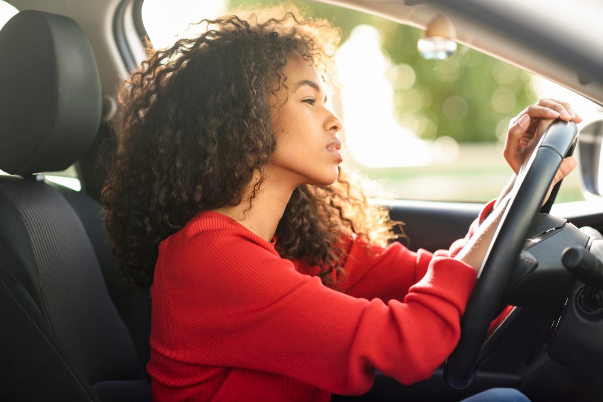 https://hips.hearstapps.com/hmg-prod/images/beautiful-young-woman-in-driving-car-royalty-free-image-1621535618.?crop=0.88973xw:1xh;center,top&resize=1200:*