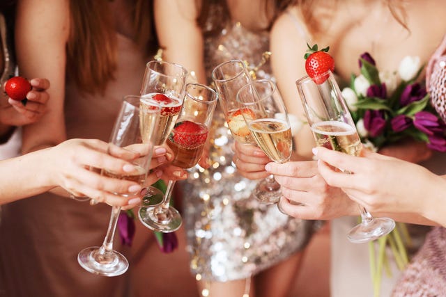 beautiful young women's hands hold glasses of champagne women's party