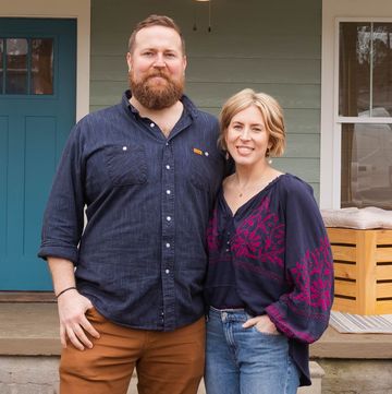 hosts ben and erin napier in front of the hollingsworth house on reveal day home town season 7