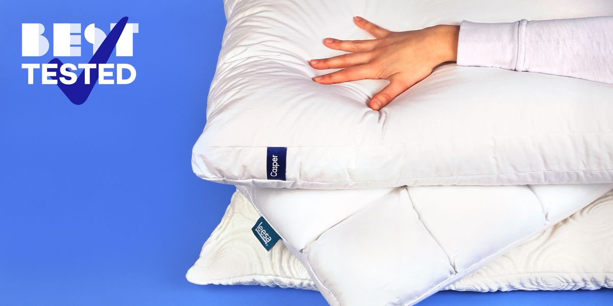 best tested hand pressing down on bed pillows
