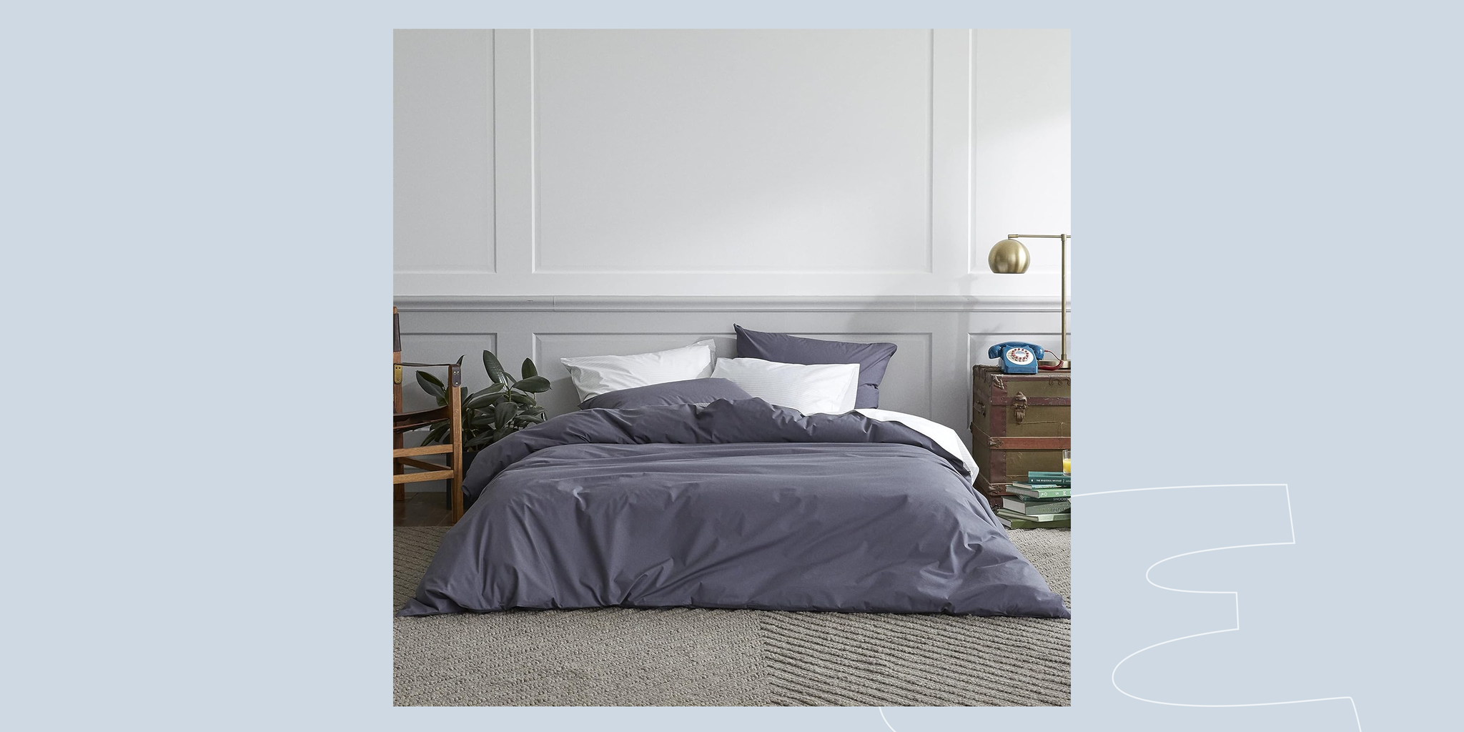 a bedroom with a bed and a chair