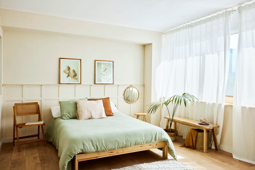 pillows on empty bed interior of bedroom with decor furniture is at home