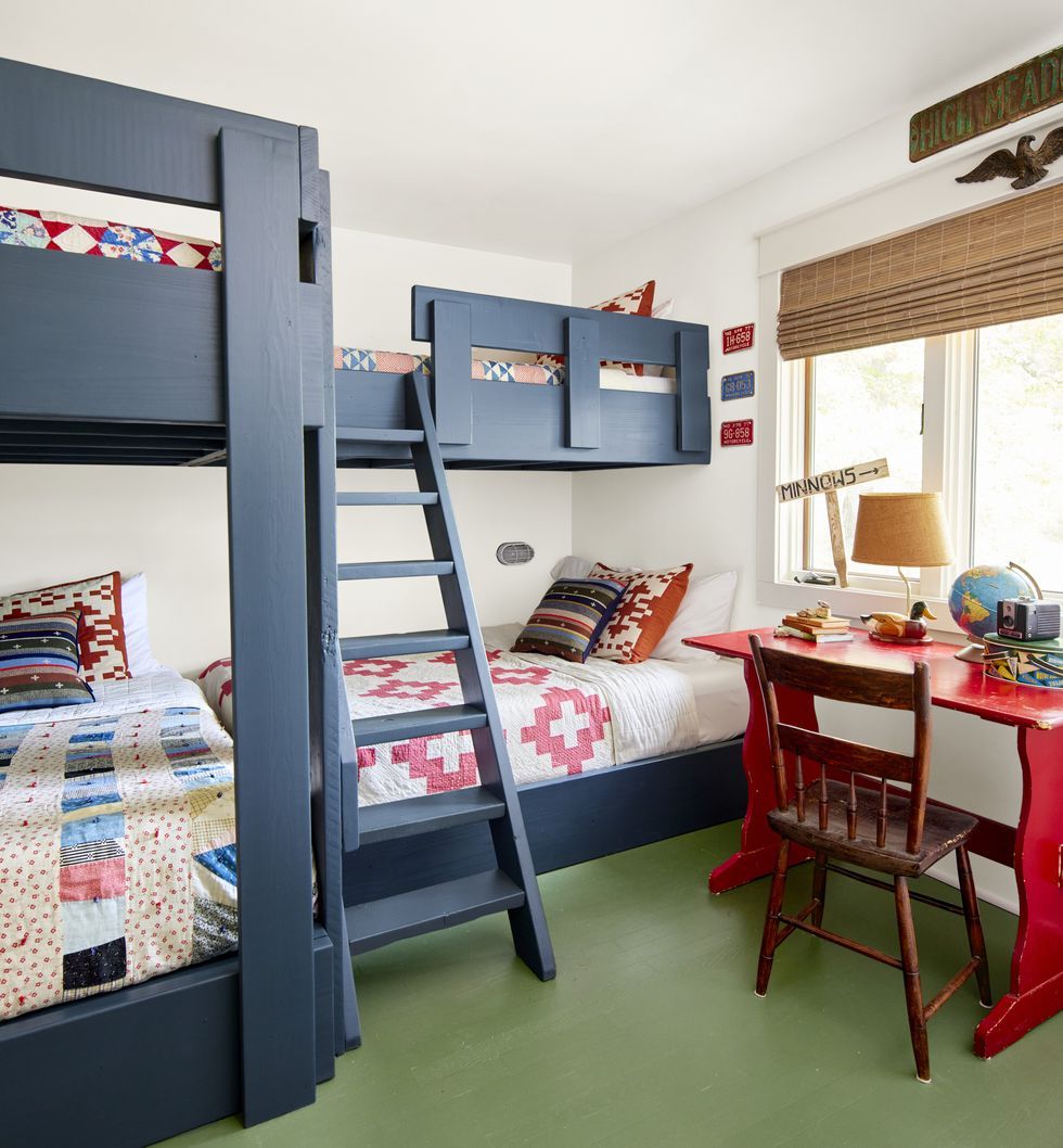 a mix of graphic quilts seen throughout the home including those that outfit the many beds in the bunk room which includes three full size beds and one twin