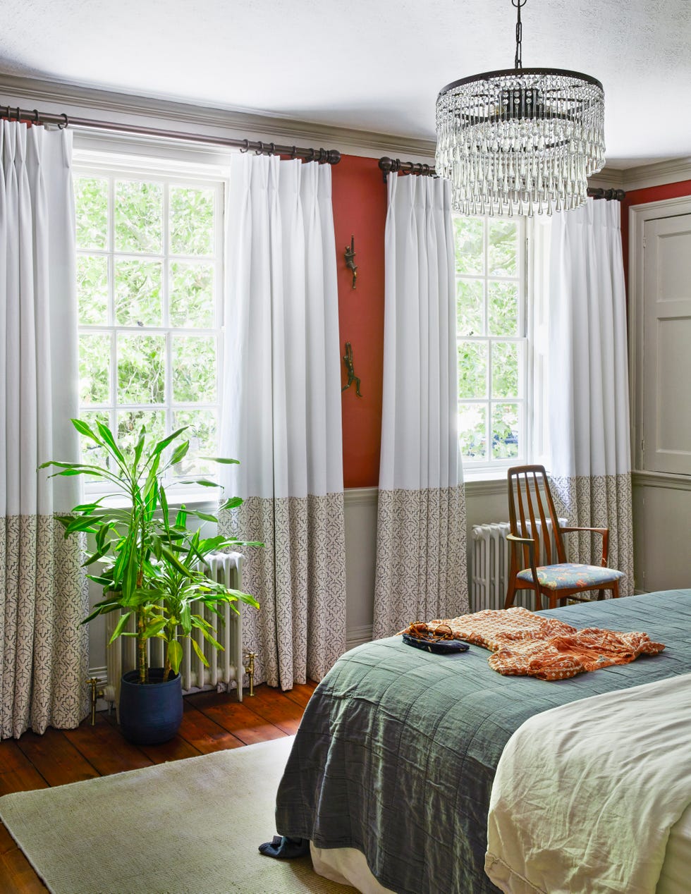bedroom with chandelier and plant