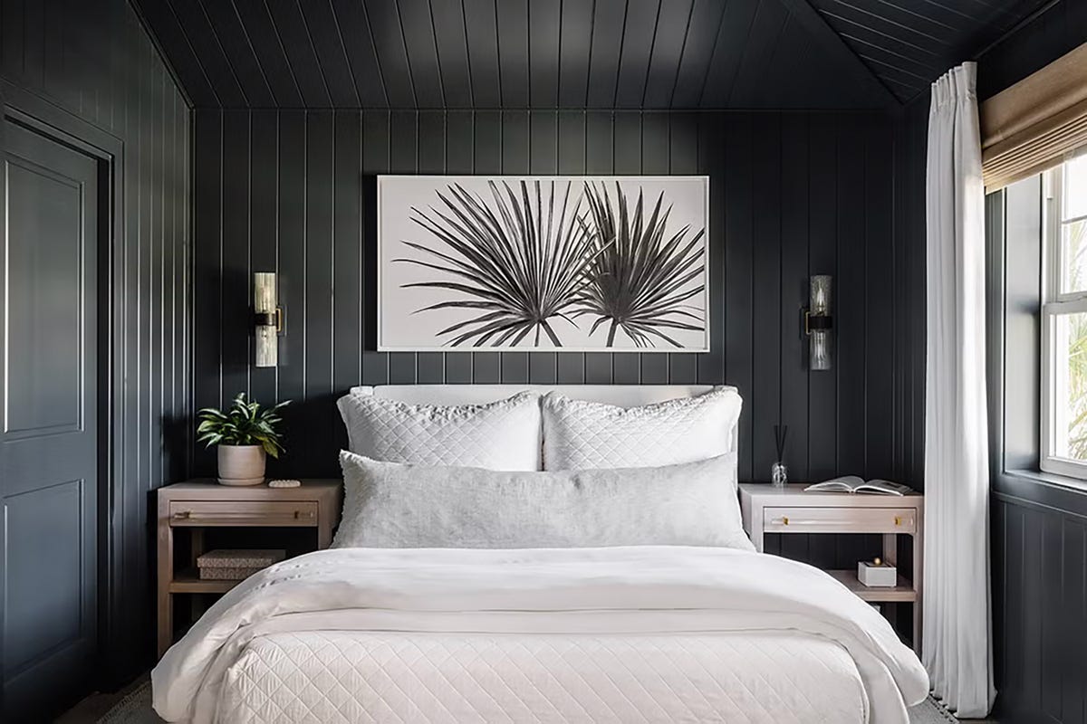 bedroom with leaf patterned wallpaper