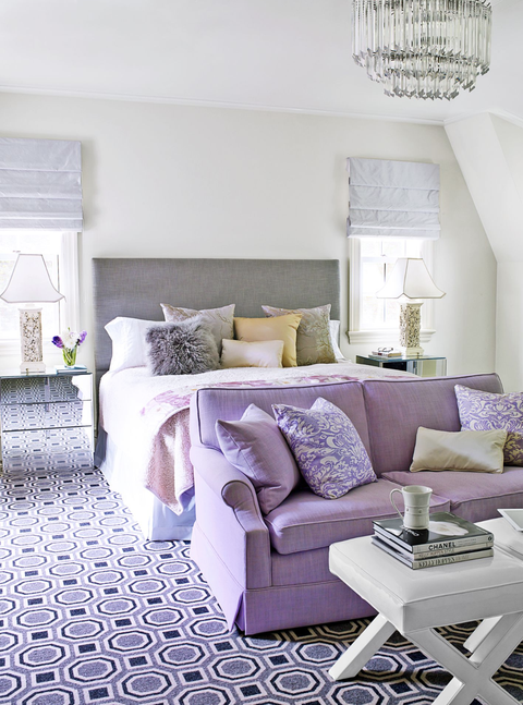 bedroom ideas, lilac bedroom with a couch and coffee table in front of the bed