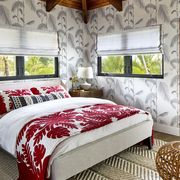 vacation home in maui, hawaii designed by breeze giannasio interiors daughter’s room bamboo on the property inspired a cole  son wallcovering rug anthropologie red blanket and pillows traditional hawaiian, purchased locally bolster pom pom at home pouf danish design store
