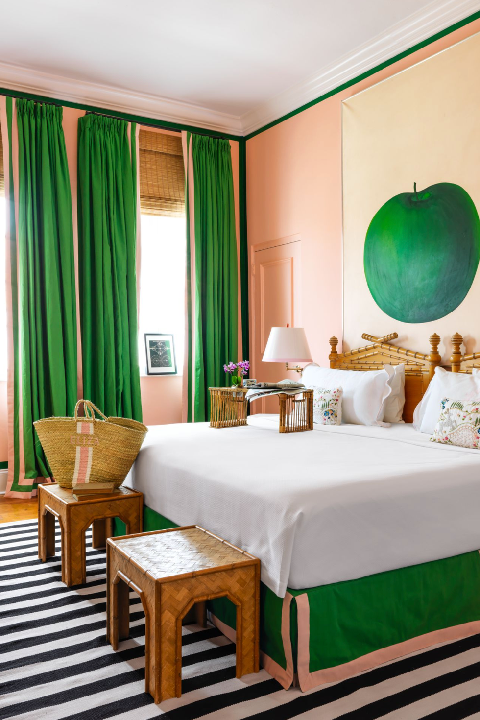 a bedroom with a green curtains