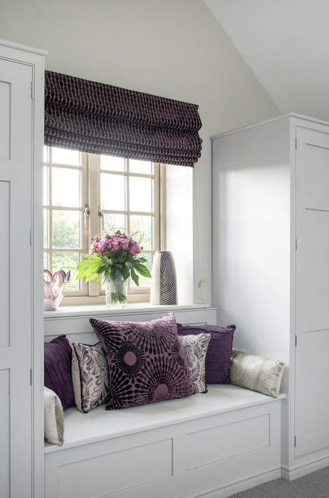 bedroom ideas, window nook with purple pillows