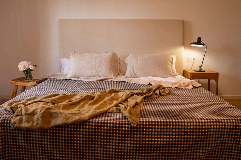 a bed with a blanket on it