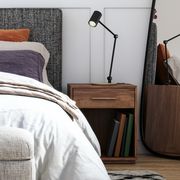 contemporary bedroom with wooden nightstand next to bed