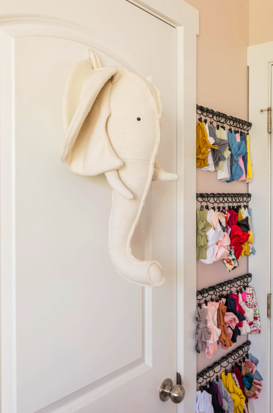 bedroom storage ideas, bows hung from rods in the bedroom