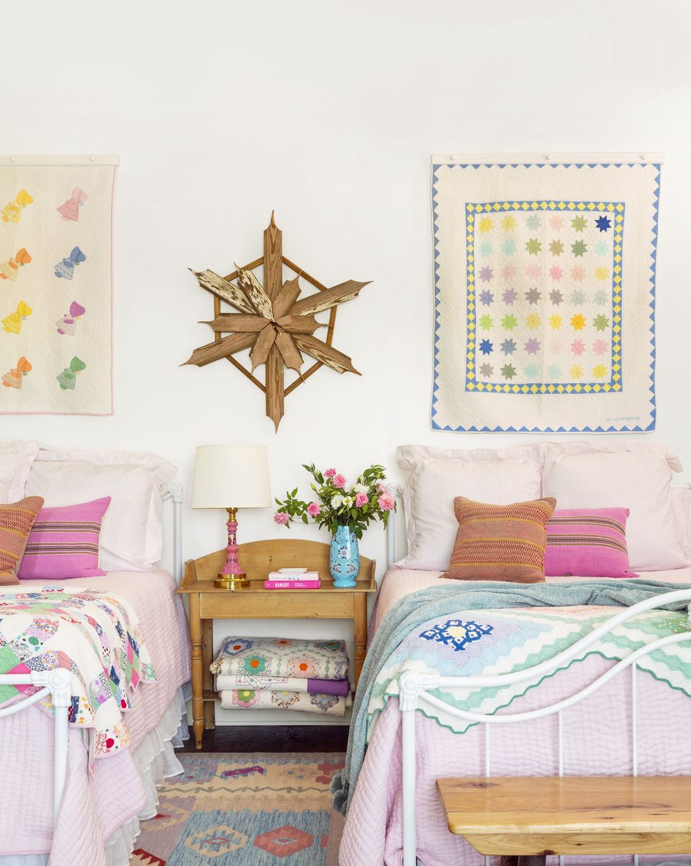 twin beds bedroom with vintage quilts