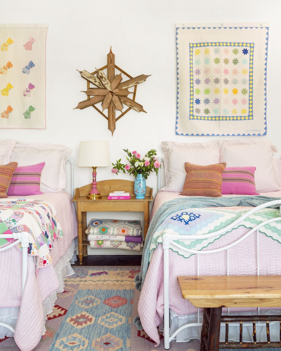 twin beds bedroom with vintage quilts
