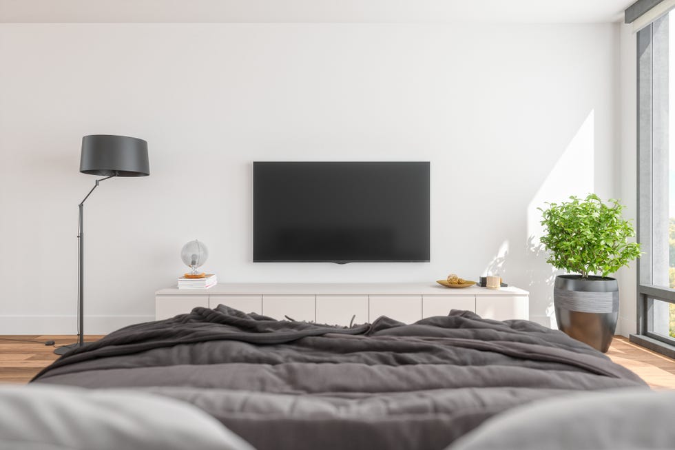 modern bedroom with television and furniture