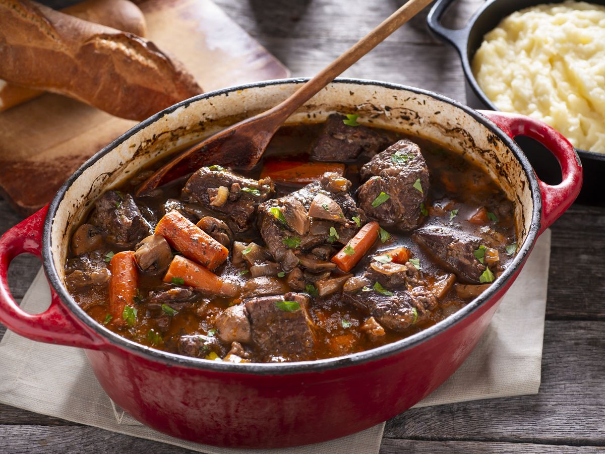 https://hips.hearstapps.com/hmg-prod/images/beef-bourguignon-royalty-free-image-1678994167.jpg?crop=0.88847xw:1xh;center,top&resize=1200:*