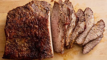 sliced brisket on a wooden platter