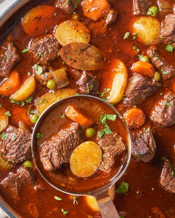 beef stew with potatoes, beef, carrots, and peas