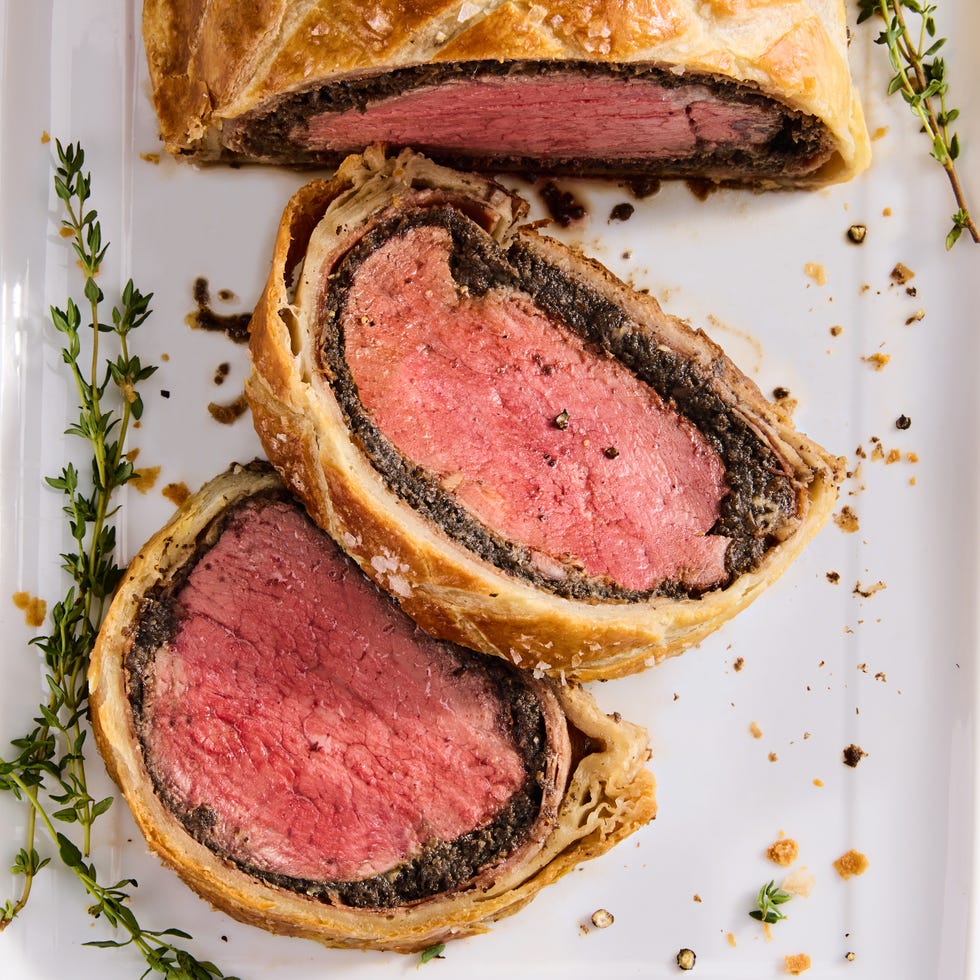 beef wellington sliced with fresh rosemary