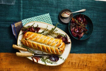 beef wellington on a platter on a beautiful table