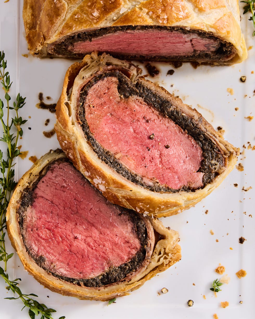 beef wellington sliced with fresh rosemary