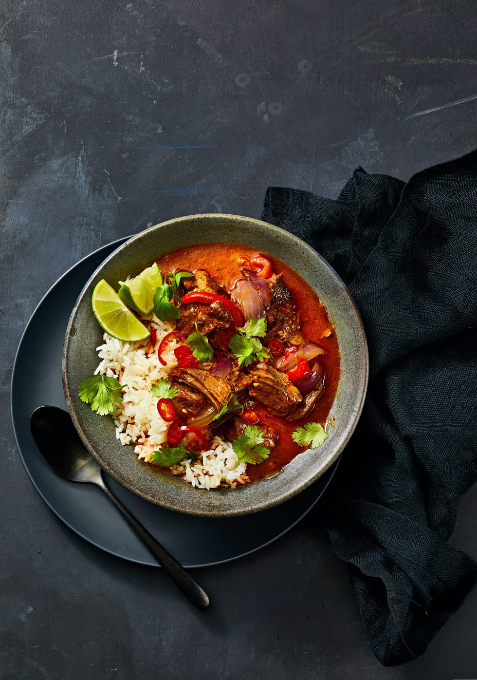beef curry and white rice with cilantro and lime