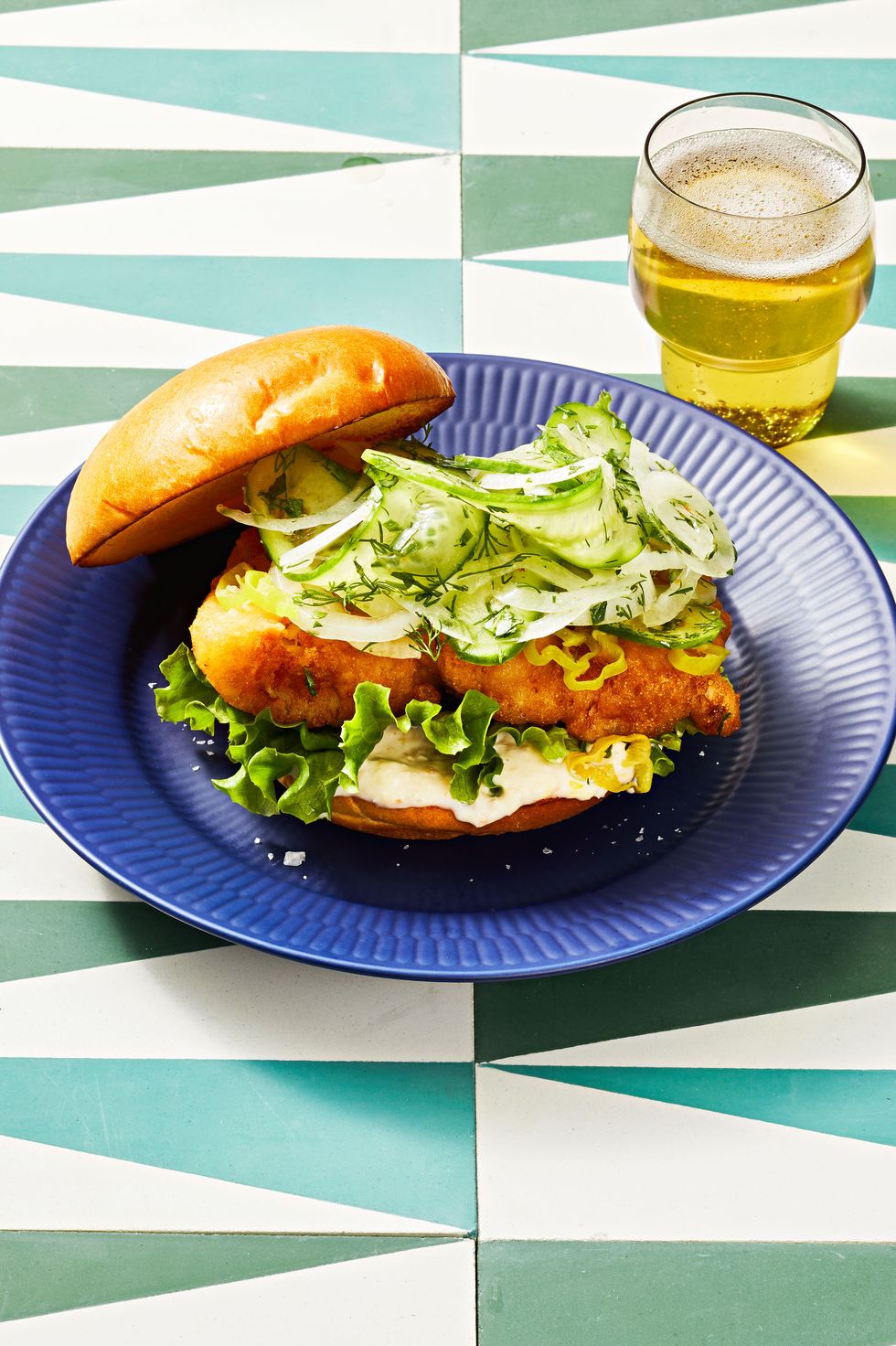 beer battered fish sandwiches on a blue plate