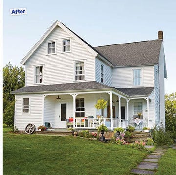 a house with a lawn and trees