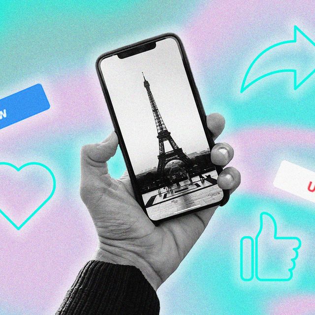hand holding up a phone with a picture of the eiffel tower