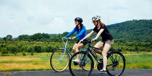 two women riding bikes