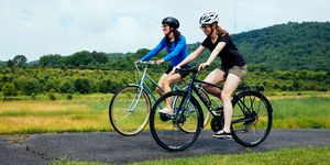 two women riding bikes