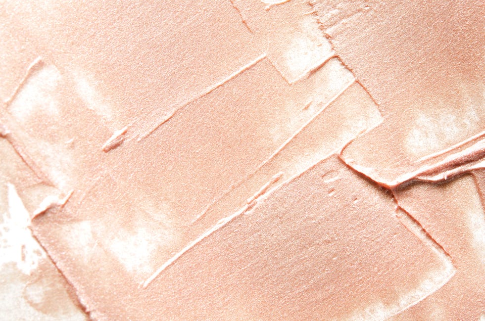 Beige smears of crushed highlighter or luminizer. - Image