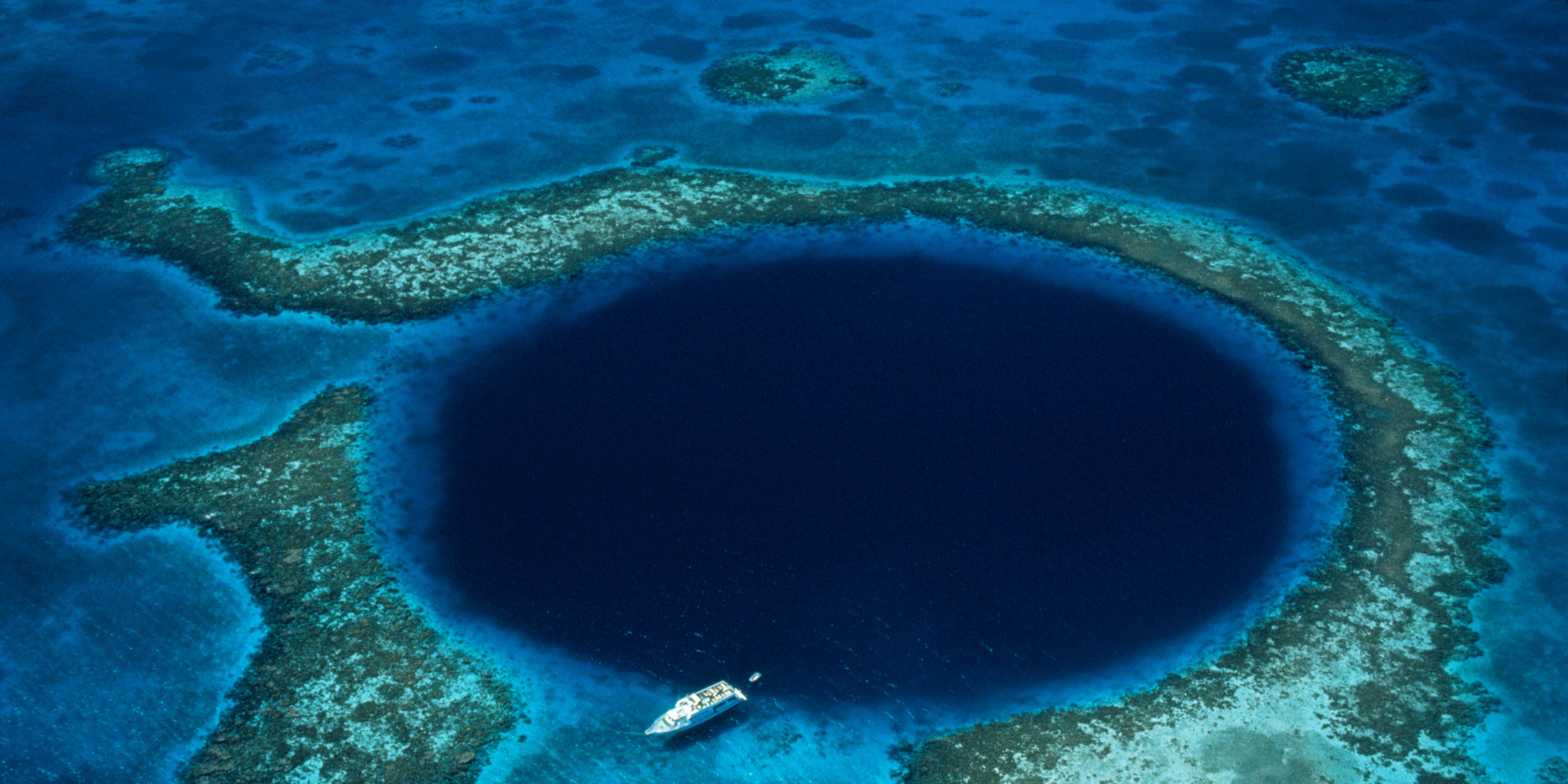 belize-lighthouse-reef-boat-moored-at-blue-hole-royalty-free-image-1743694600.pjpeg