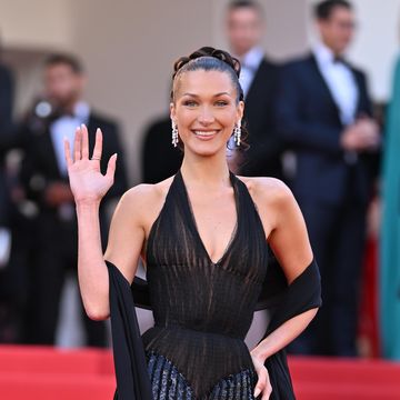 bella hadid wearing a vintage versace black dress at the 77th annual cannes film festival beating hearts premiere
