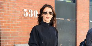 bella hadid is spotted wearing a black vintage outfit in new york city featuring a cropped jacket capri trousers and heels