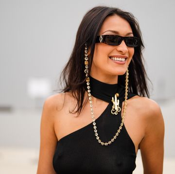 paris, france june 25 bella hadid wears sunglasses with a bejeweled diamonds chain, a black off shoulder cropped top with turtleneck, outside dior, during paris fashion week menswear springsummer 2022, on june 25, 2021 in paris, france photo by edward berthelotgetty images