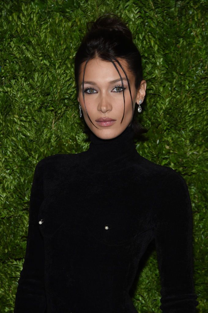 Bella Hadid spotted waving huge Palestinian flag at protest in support of  her family's homeland in NYC