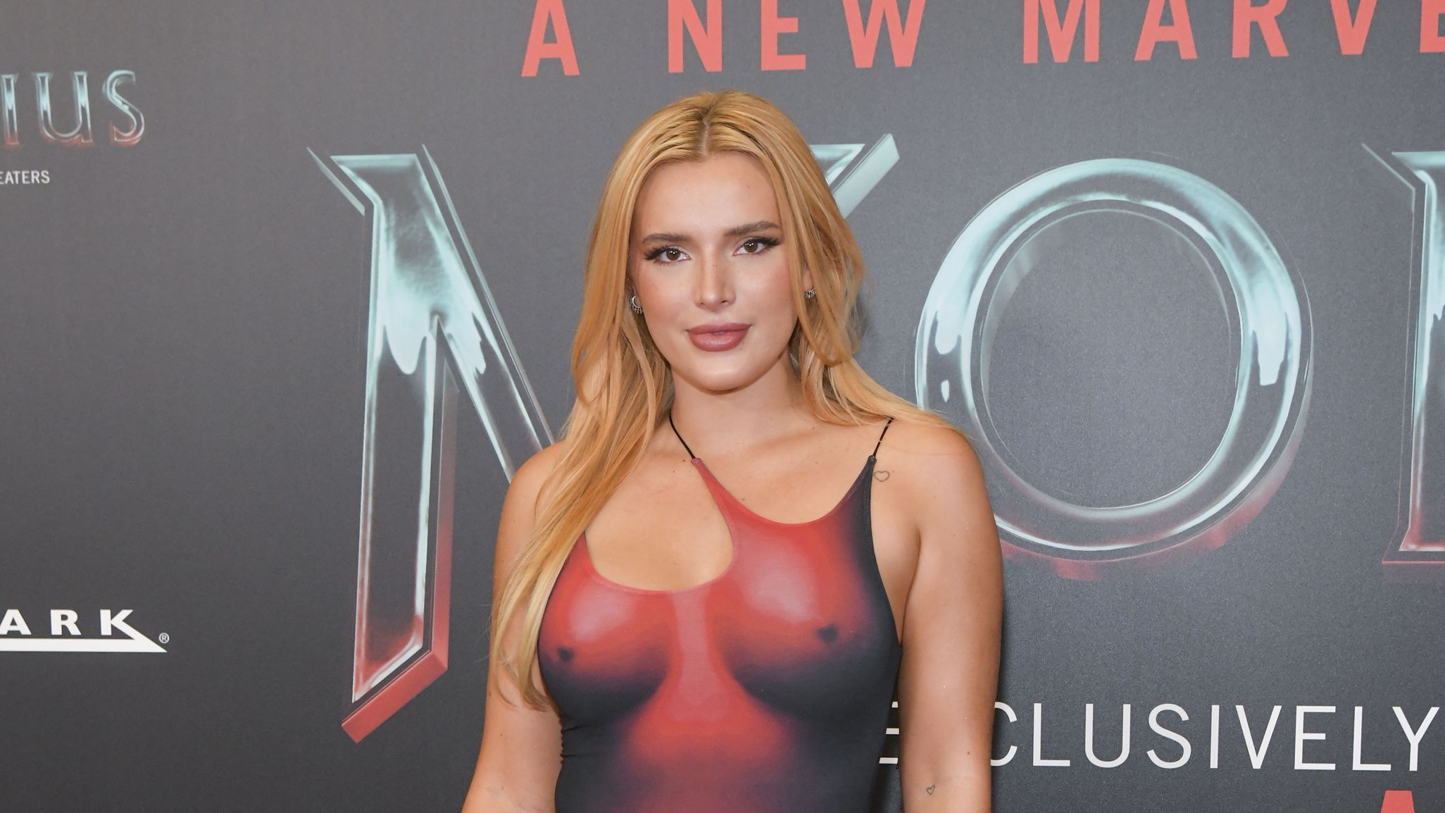 2052px x 1154px - Bella Thorne Rocked A Red 'Naked' Dress at the 'Morbius' Premiere
