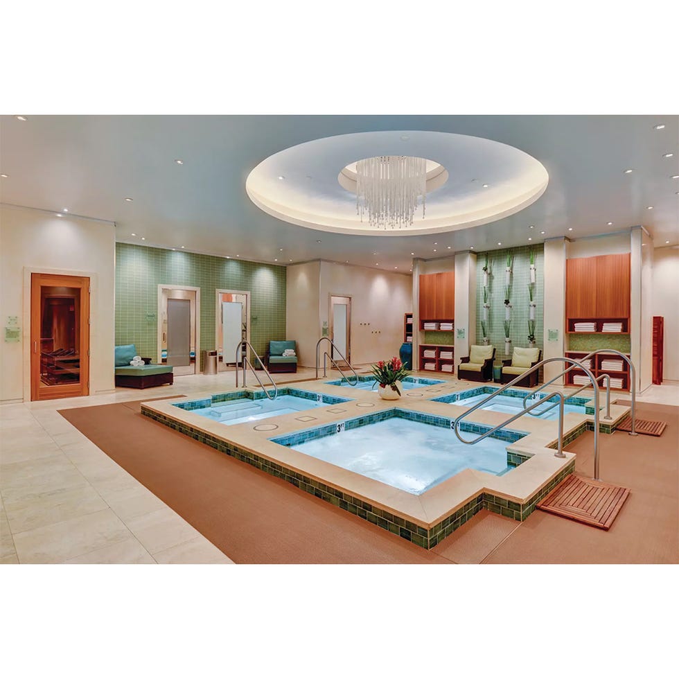 spa area featuring multiple hydrotherapy pools and relaxation spaces