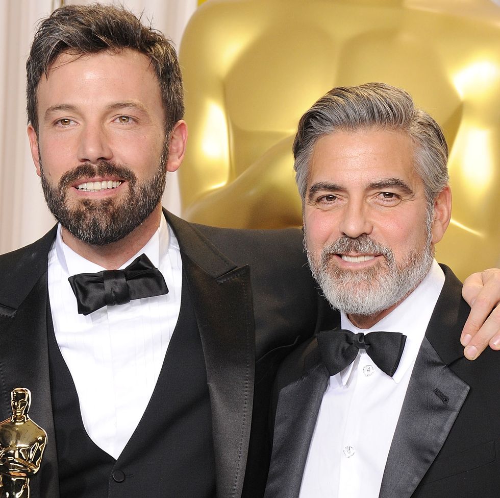 ben affleck and george clooney pose together with their academy awards at the 85th oscars ceremony in 2013