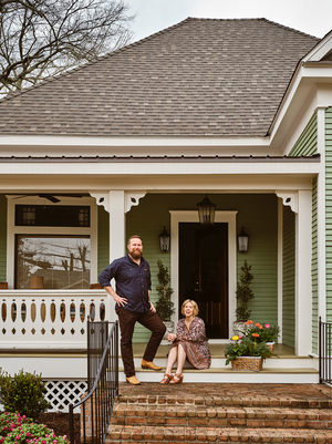 Successful home renovation business owners in their beautifully designed space